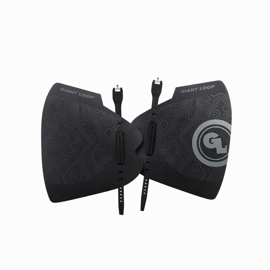 A pair of black motorcycle hand guards with a geometric pattern and the Giant Loop logo on the upper corner.