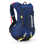 USWE Moto Hydro 12L hydration pack in navy blue with neon yellow bottom straps, red hydration bladder visible at top, and white USWE branding on front zippered pocket, displayed at three-quarter angle showing elastic shoulder harness and compact race fit design.
