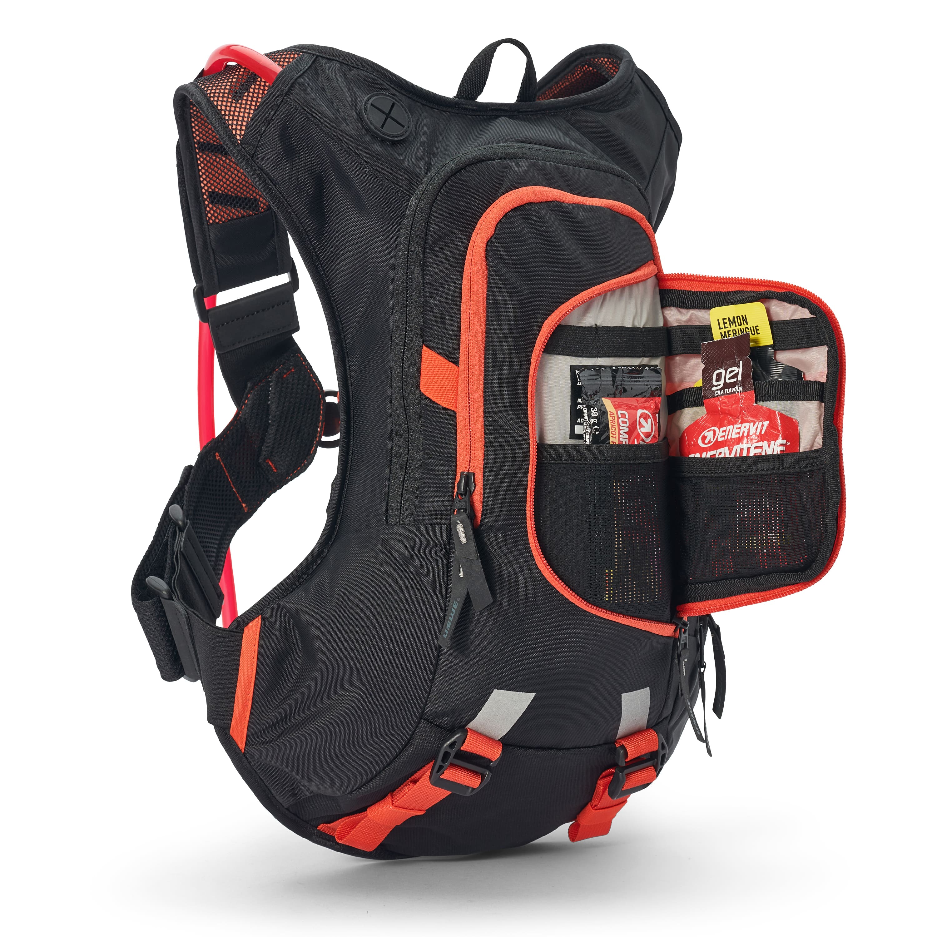 USWE Moto Hydro 12L hydration pack in black with orange accents, featuring detachable front organizer pocket unzipped to reveal energy gels and nutrition storage in elastic loops and mesh compartments, with red hydration bladder visible at top and reflective patches on lower straps.