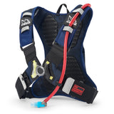 USWE Moto Hydro 3L hydration pack in blue with ventilated black mesh back panel, elastic shoulder straps with reflective gray accents, red hydration tube with blue bite valve, and No Dancing Monkey waist belt featuring red logo patch.