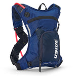 USWE Moto Hydro 3L hydration pack in blue colorway with red hydration tube extending from mesh shoulder pocket, black elastic NDM harness straps with reflective details, and white USWE branding on front organizer pocket.