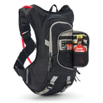 USWE Moto Hydro 8L hydration pack displayed with front pocket unzipped revealing organized storage compartments holding energy gels, phone, and nutrition items, showcasing the pack's internal organization system and gray trim details.