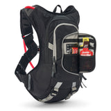 USWE Moto Hydro 8L hydration pack displayed with front pocket unzipped revealing organized storage compartments holding energy gels, phone, and nutrition items, showcasing the pack's internal organization system and gray trim details.