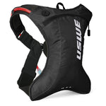 USWE OUTLANDER Moto 2L hydration pack in black with red hydration tube, featuring No Dancing Monkey 4-point harness system and ultralight ripstop construction for dirt bike and enduro riding.