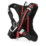 USWE OUTLANDER Moto 2L hydration backpack shown from rear angle, displaying breathable mesh back panel, elastic 4-point harness straps with reflective details, and integrated red hydration tube routing for motocross and enduro racing.