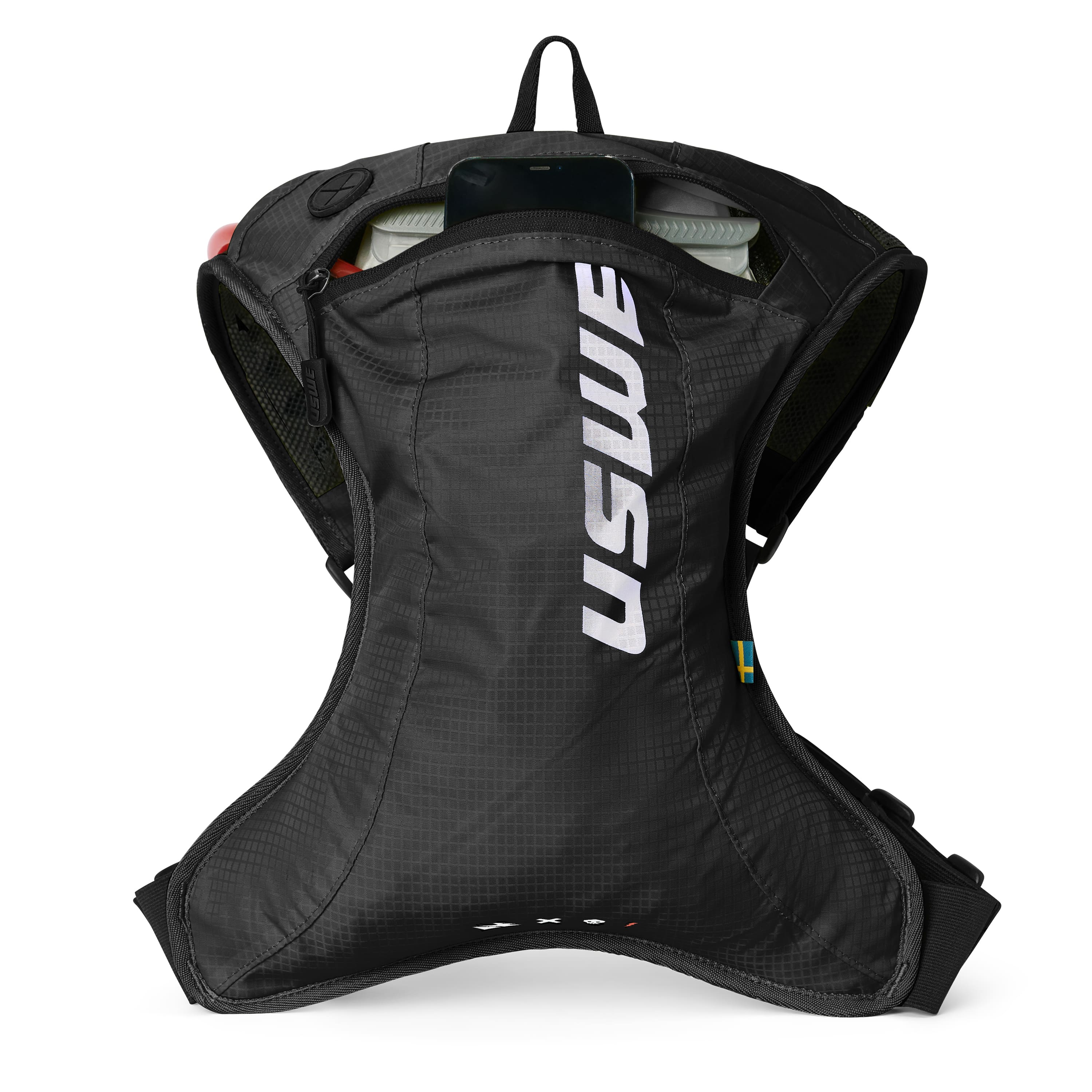 USWE OUTLANDER Moto 2L hydration pack in black with vertical white logo branding, shown laid flat to display the contoured ergonomic shape, elastic side panels, and top compartment with visible 1.5L hydration bladder for dirt bike racing.