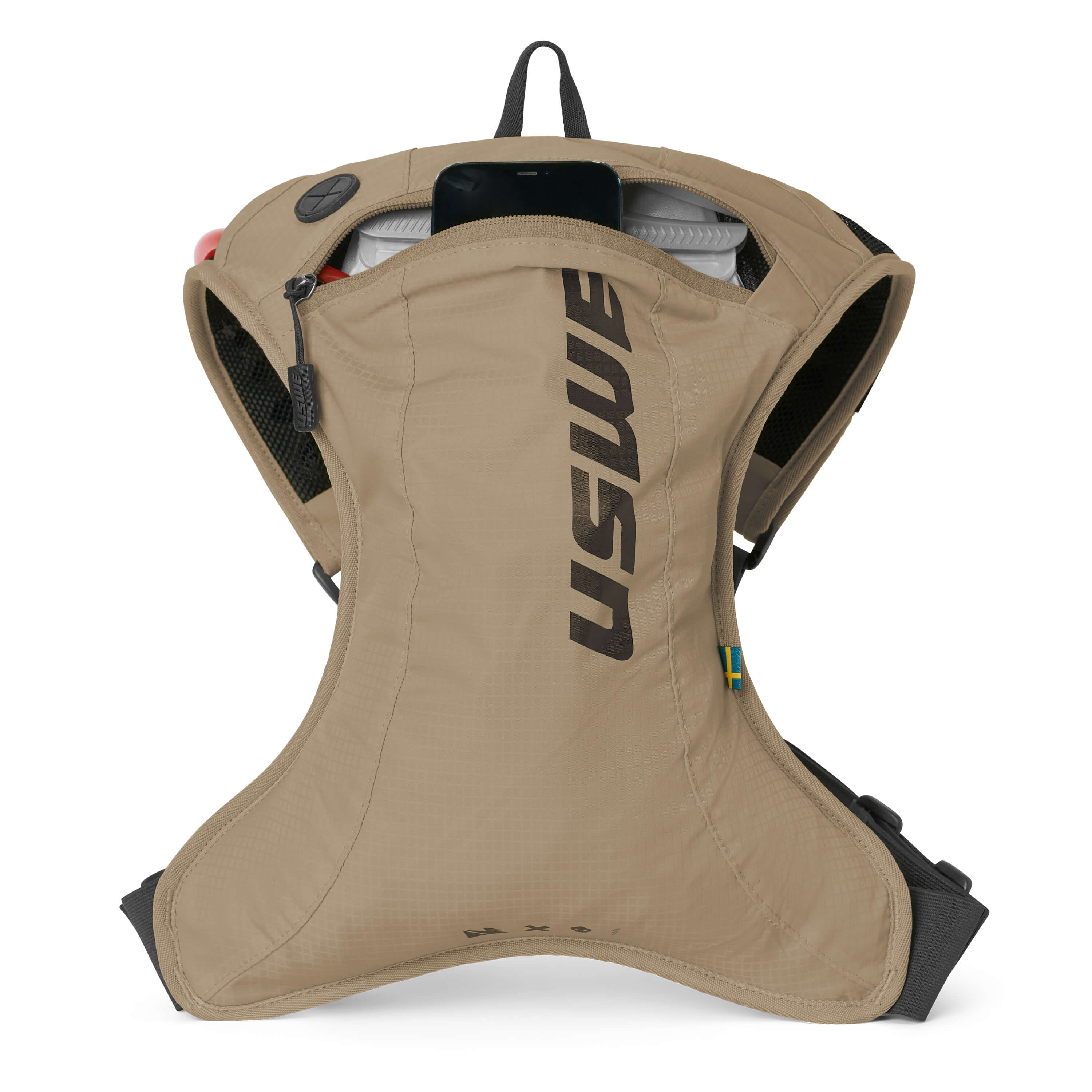 USWE OUTLANDER Moto 2L hydration pack in sand with main compartment unzipped to reveal the 1.5L Elite Hydration Bladder inside, showing the curved ergonomic body shape and elastic side compression panels for a locked-down fit during dirt bike riding.
