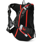 USWE OUTLANDER Moto 9L hydration pack in Black with red elastic NDM harness straps, breathable mesh back panel, and No Dancing Monkey logo patch on lower lumbar strap with hydration tube routed through shoulder system.