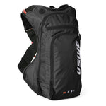 USWE OUTLANDER Moto 9L motorcycle hydration pack in Black colorway with white vertical logo branding, ripstop fabric construction, and red hydration tube visible on elastic shoulder harness.