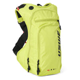 USWE OUTLANDER Moto 9L hydration pack in Crazy Yellow with elastic NDM 4-point harness straps and multiple zippered compartments for motorcycle enduro riding.