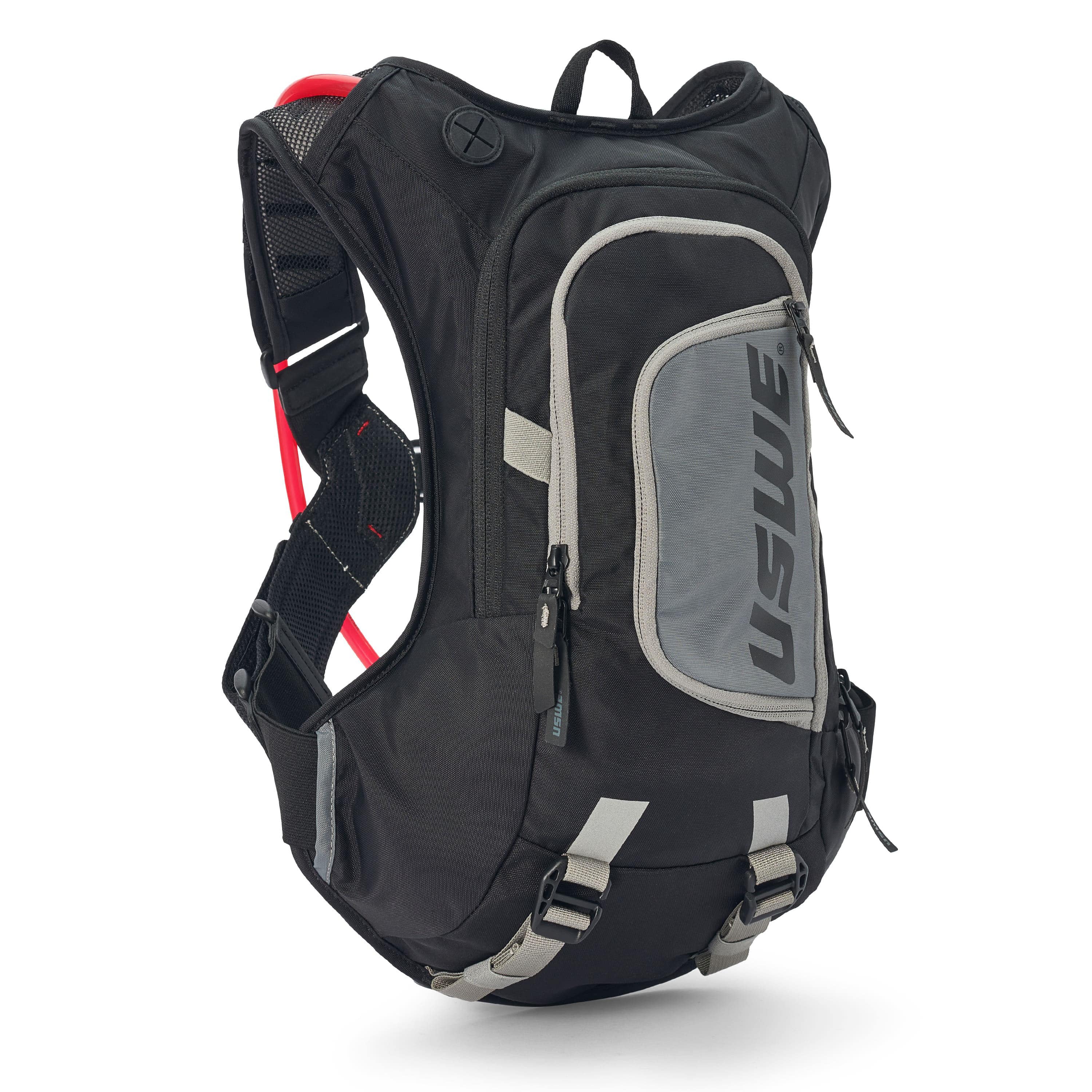 USWE Moto Hydro 8L hydration pack in black and gray with elastic No Dancing Monkey harness straps, front zippered pocket, and integrated hydration bladder compartment for dirt bike and enduro riding.