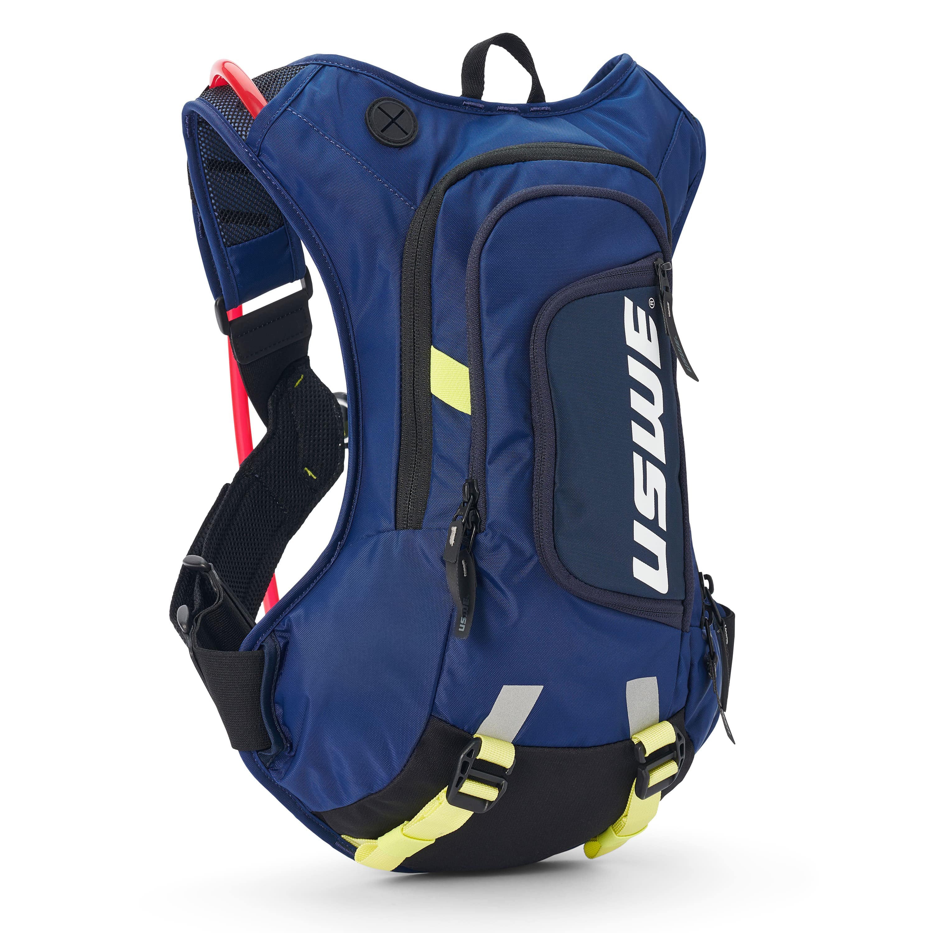 USWE Moto Hydro 8L hydration pack in blue with white USWE branding, featuring black elastic NDM harness straps with red and yellow-green accents, mesh side pocket holding a red tool, dual front zippered compartments, and reflective details on the lower section for off-road motorcycle use.